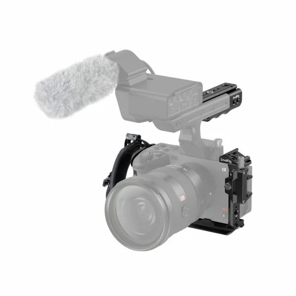 The Sony FX30 is mounted in the SmallRig Handheld Cage Kit 4184, equipped with a large lens, top handle, and an external microphone fitted with a grey furry windscreen.