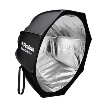 Profoto Beauty Dish Silver, valokuvaukseen tarkoitettu softbox, jossa on hopeinen sisäpuoli ja musta ulkopuoli valon hajottamista varten, on esillä valkoista taustaa vasten.